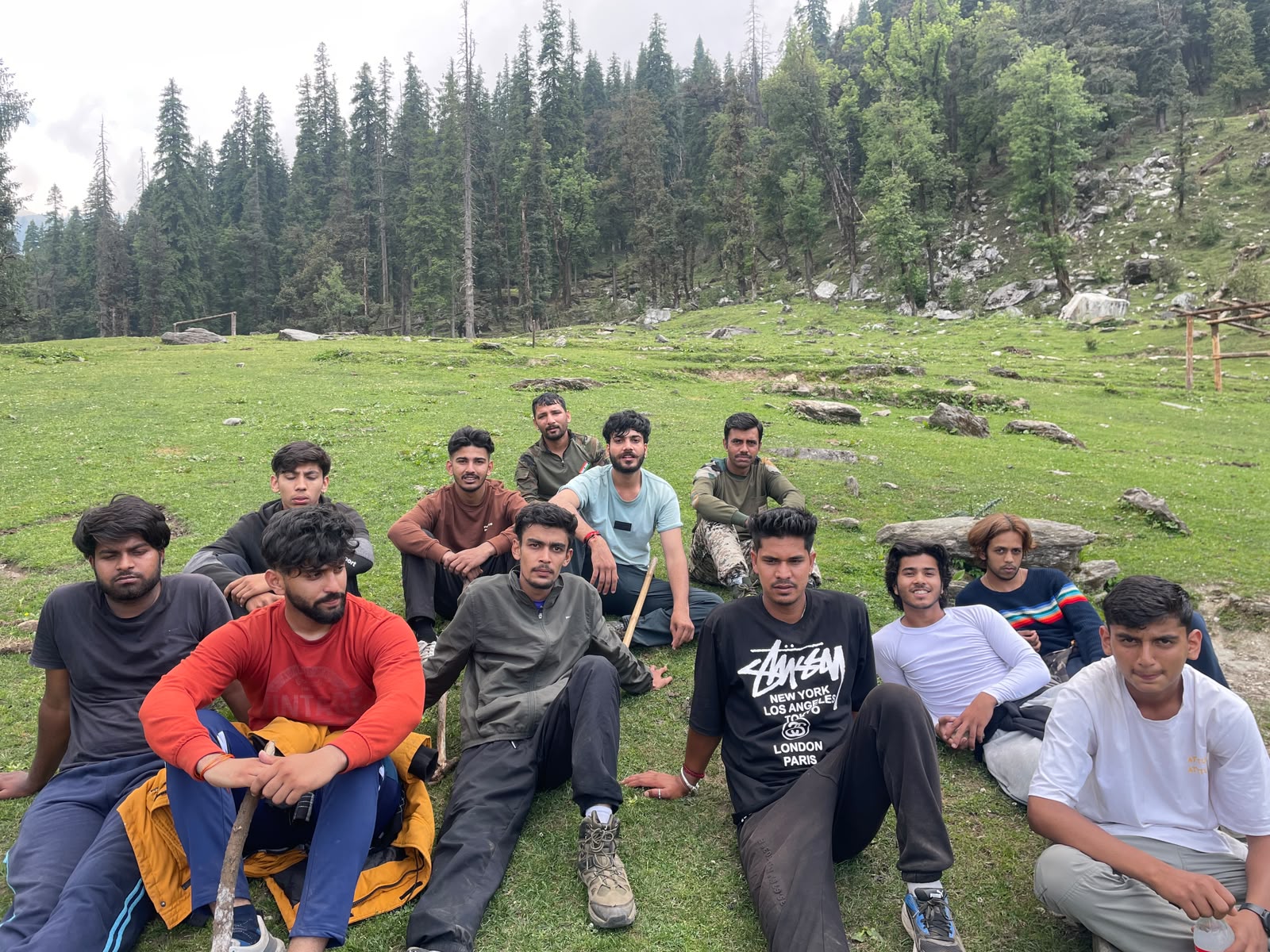 Trek Team Resting on Alpine Meadow